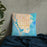 Custom St. Petersburg Florida Map Throw Pillow in Watercolor on Bedding Against Wall