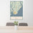 24x36 St. Simons Island Georgia Map Print Portrait Orientation in Woodblock Style Behind 2 Chairs Table and Potted Plant