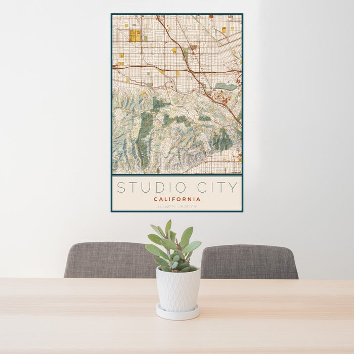 24x36 Studio City California Map Print Portrait Orientation in Woodblock Style Behind 2 Chairs Table and Potted Plant