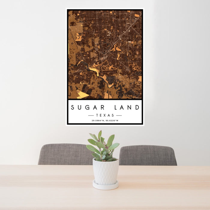 24x36 Sugar Land Texas Map Print Portrait Orientation in Ember Style Behind 2 Chairs Table and Potted Plant