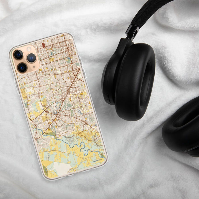 Custom Sugar Land Texas Map Phone Case in Woodblock on Table with Black Headphones