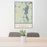 24x36 Sunapee New Hampshire Map Print Portrait Orientation in Woodblock Style Behind 2 Chairs Table and Potted Plant