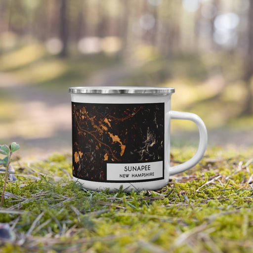 Right View Custom Sunapee New Hampshire Map Enamel Mug in Ember on Grass With Trees in Background