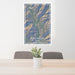 24x36 Sun Valley Idaho Map Print Portrait Orientation in Afternoon Style Behind 2 Chairs Table and Potted Plant