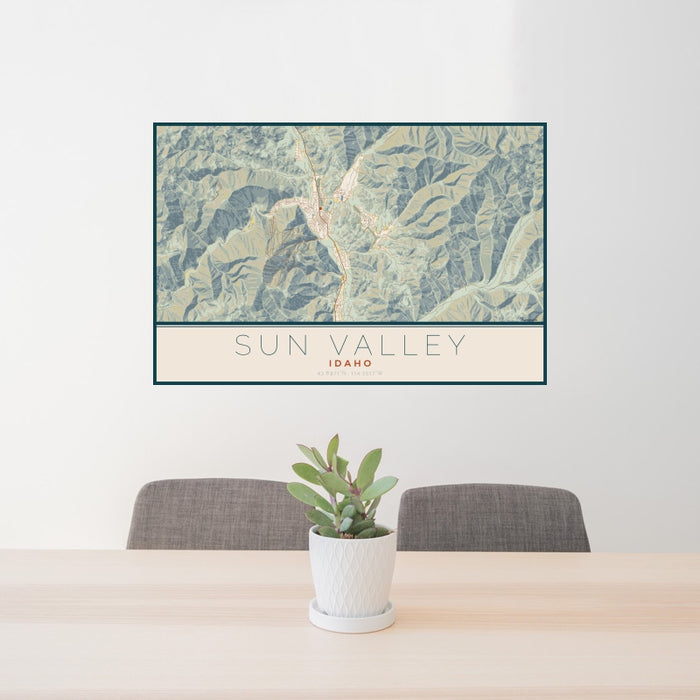 24x36 Sun Valley Idaho Map Print Landscape Orientation in Woodblock Style Behind 2 Chairs Table and Potted Plant