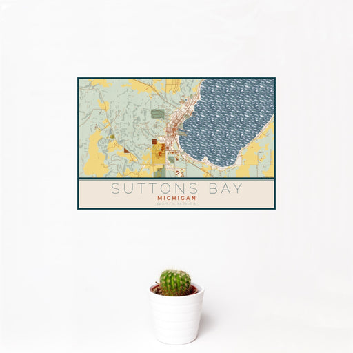 12x18 Suttons Bay Michigan Map Print Landscape Orientation in Woodblock Style With Small Cactus Plant in White Planter