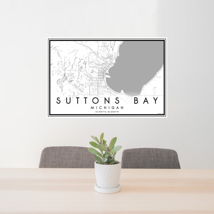 24x36 Suttons Bay Michigan Map Print Lanscape Orientation in Classic Style Behind 2 Chairs Table and Potted Plant