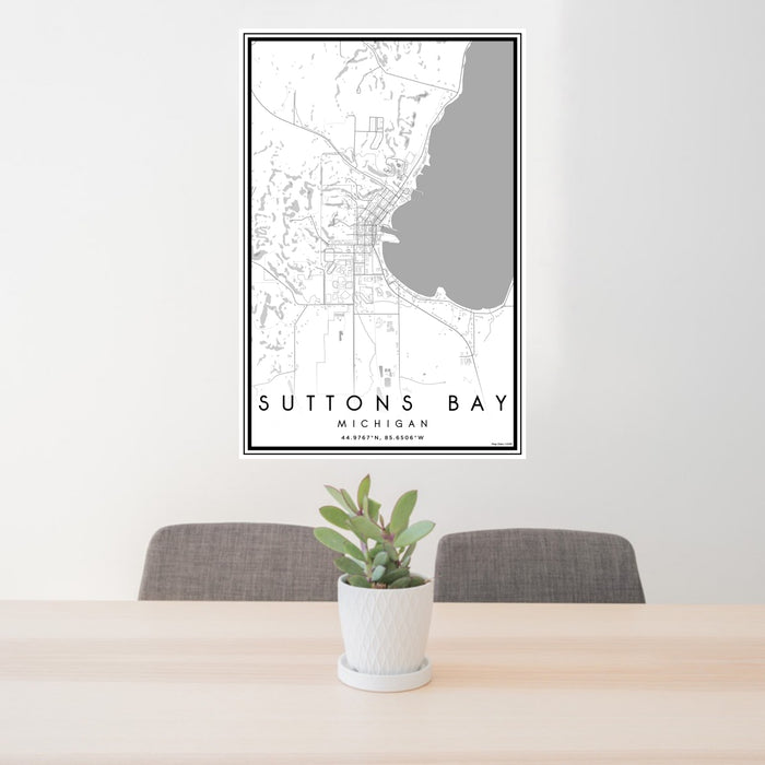 24x36 Suttons Bay Michigan Map Print Portrait Orientation in Classic Style Behind 2 Chairs Table and Potted Plant