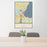 24x36 Suttons Bay Michigan Map Print Portrait Orientation in Woodblock Style Behind 2 Chairs Table and Potted Plant