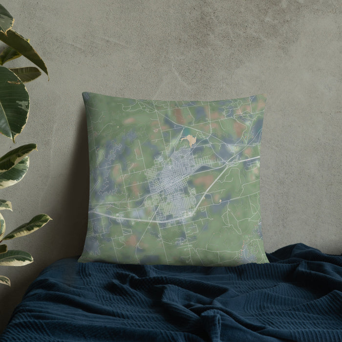 Custom Sweetwater Texas Map Throw Pillow in Afternoon on Bedding Against Wall