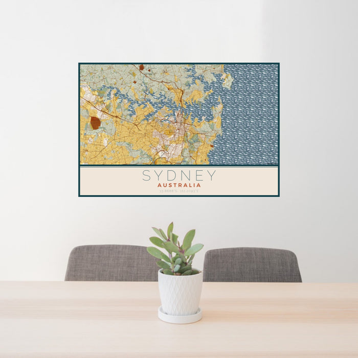 24x36 Sydney Australia Map Print Lanscape Orientation in Woodblock Style Behind 2 Chairs Table and Potted Plant