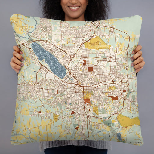 Person holding 22x22 Custom Syracuse New York Map Throw Pillow in Woodblock