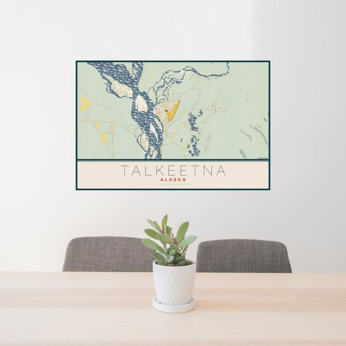 24x36 Talkeetna Alaska Map Print Lanscape Orientation in Woodblock Style Behind 2 Chairs Table and Potted Plant
