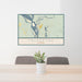 24x36 Talkeetna Alaska Map Print Lanscape Orientation in Woodblock Style Behind 2 Chairs Table and Potted Plant