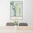 24x36 Talkeetna Alaska Map Print Portrait Orientation in Woodblock Style Behind 2 Chairs Table and Potted Plant