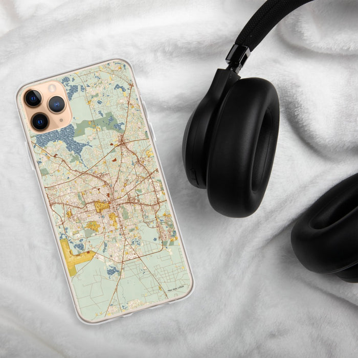 Custom Tallahassee Florida Map Phone Case in Woodblock on Table with Black Headphones