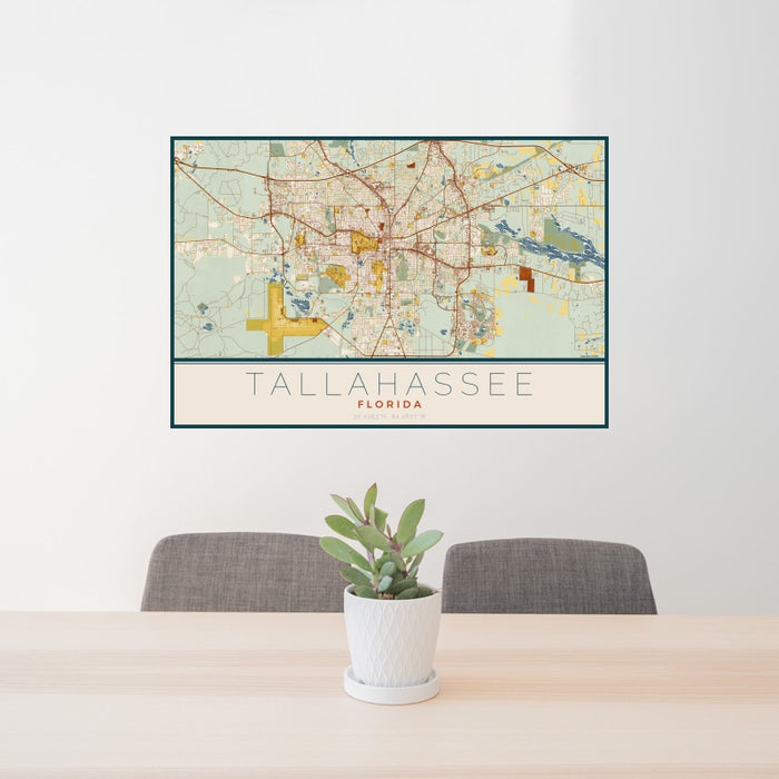 24x36 Tallahassee Florida Map Print Landscape Orientation in Woodblock Style Behind 2 Chairs Table and Potted Plant
