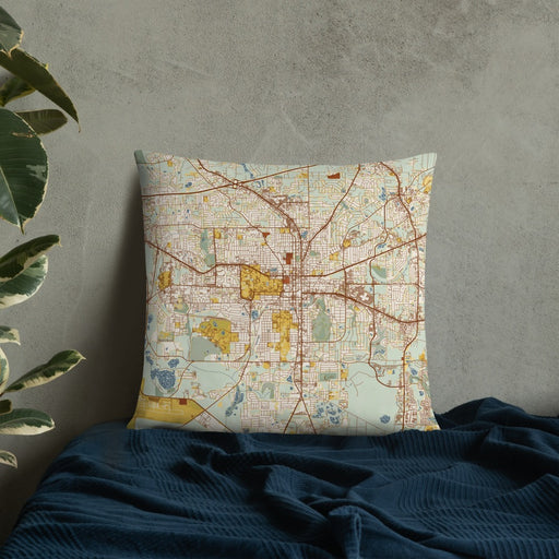 Custom Tallahassee Florida Map Throw Pillow in Woodblock on Bedding Against Wall