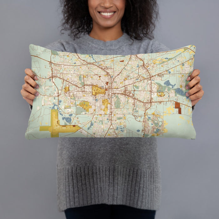 Person holding 20x12 Custom Tallahassee Florida Map Throw Pillow in Woodblock