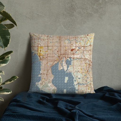 Custom Tampa Florida Map Throw Pillow in Woodblock on Bedding Against Wall