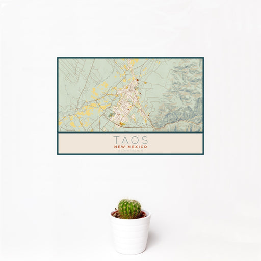 12x18 Taos New Mexico Map Print Landscape Orientation in Woodblock Style With Small Cactus Plant in White Planter