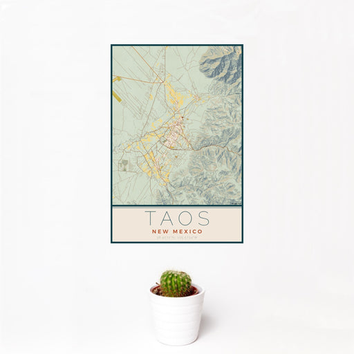 12x18 Taos New Mexico Map Print Portrait Orientation in Woodblock Style With Small Cactus Plant in White Planter