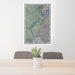 24x36 Taos New Mexico Map Print Portrait Orientation in Afternoon Style Behind 2 Chairs Table and Potted Plant