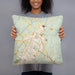 Person holding 18x18 Custom Taos New Mexico Map Throw Pillow in Woodblock