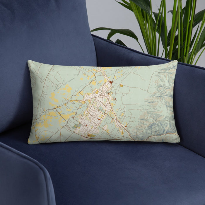 Custom Taos New Mexico Map Throw Pillow in Woodblock on Blue Colored Chair