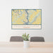 24x36 Tellico Village Tennessee Map Print Lanscape Orientation in Woodblock Style Behind 2 Chairs Table and Potted Plant