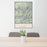 24x36 Telluride Colorado Map Print Portrait Orientation in Woodblock Style Behind 2 Chairs Table and Potted Plant