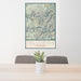 24x36 Telluride Colorado Map Print Portrait Orientation in Woodblock Style Behind 2 Chairs Table and Potted Plant
