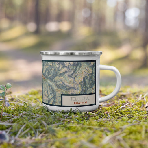Right View Custom Telluride Colorado Map Enamel Mug in Woodblock on Grass With Trees in Background