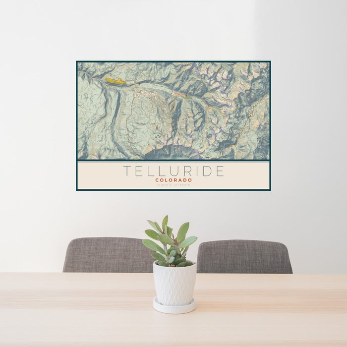 24x36 Telluride Colorado Map Print Landscape Orientation in Woodblock Style Behind 2 Chairs Table and Potted Plant