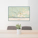 24x36 Terlingua Texas Map Print Lanscape Orientation in Woodblock Style Behind 2 Chairs Table and Potted Plant