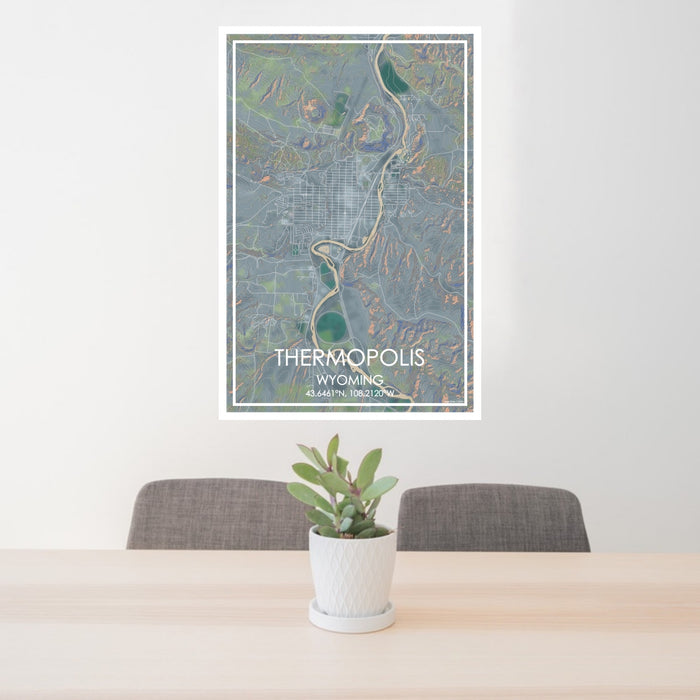 24x36 Thermopolis Wyoming Map Print Portrait Orientation in Afternoon Style Behind 2 Chairs Table and Potted Plant
