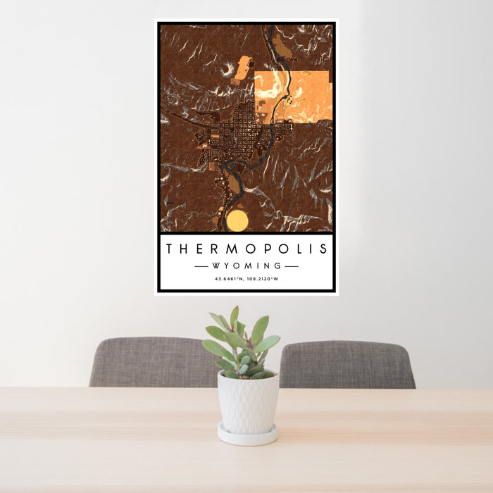 24x36 Thermopolis Wyoming Map Print Portrait Orientation in Ember Style Behind 2 Chairs Table and Potted Plant
