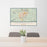 24x36 Thermopolis Wyoming Map Print Lanscape Orientation in Woodblock Style Behind 2 Chairs Table and Potted Plant