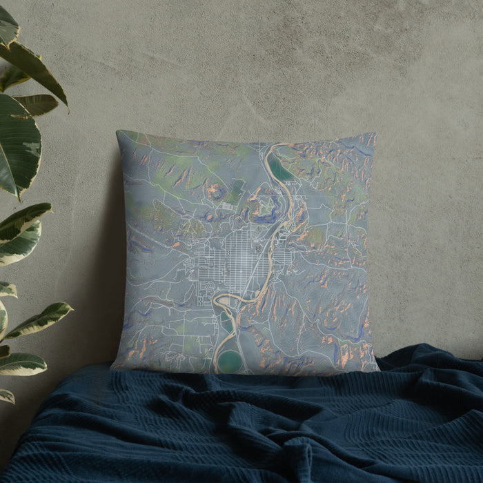 Custom Thermopolis Wyoming Map Throw Pillow in Afternoon on Bedding Against Wall