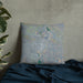 Custom Thermopolis Wyoming Map Throw Pillow in Afternoon on Bedding Against Wall
