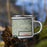 Right View Custom Thermopolis Wyoming Map Enamel Mug in Woodblock on Grass With Trees in Background