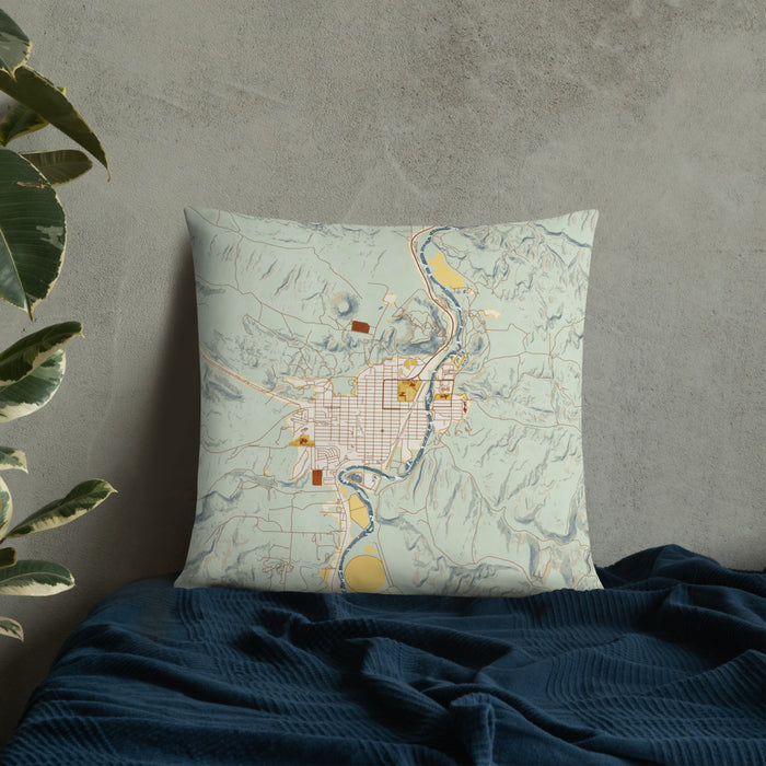 Custom Thermopolis Wyoming Map Throw Pillow in Woodblock on Bedding Against Wall