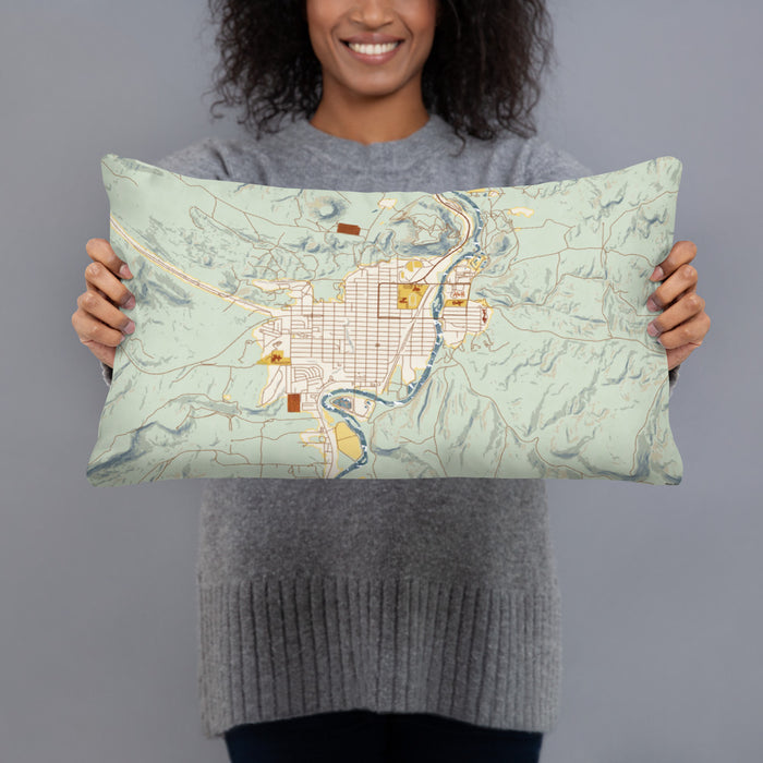 Person holding 20x12 Custom Thermopolis Wyoming Map Throw Pillow in Woodblock