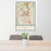 24x36 The Woodlands Texas Map Print Portrait Orientation in Woodblock Style Behind 2 Chairs Table and Potted Plant