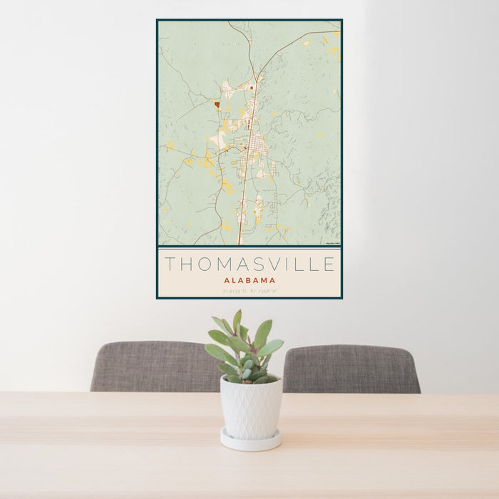 24x36 Thomasville Alabama Map Print Portrait Orientation in Woodblock Style Behind 2 Chairs Table and Potted Plant