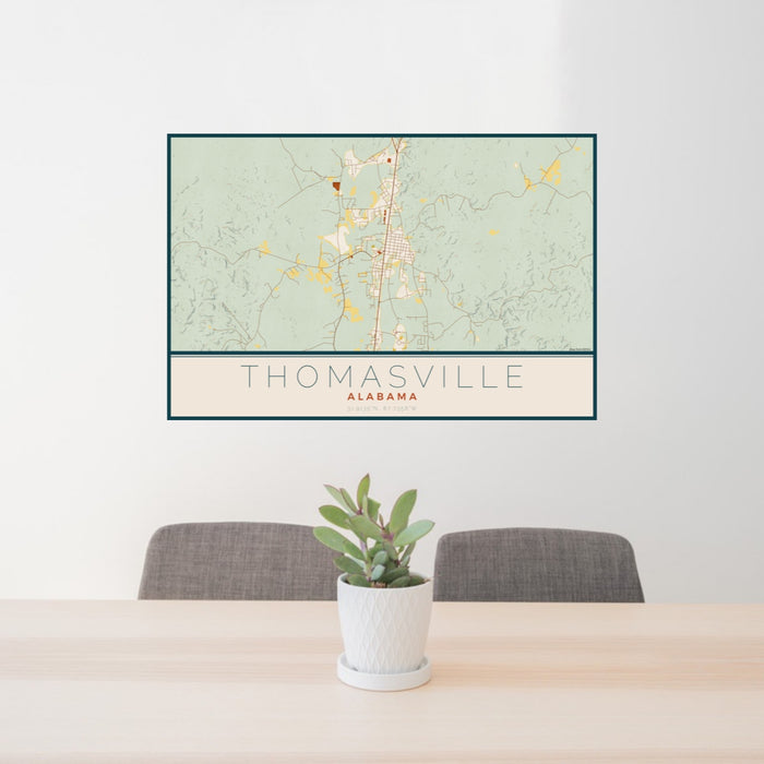24x36 Thomasville Alabama Map Print Landscape Orientation in Woodblock Style Behind 2 Chairs Table and Potted Plant
