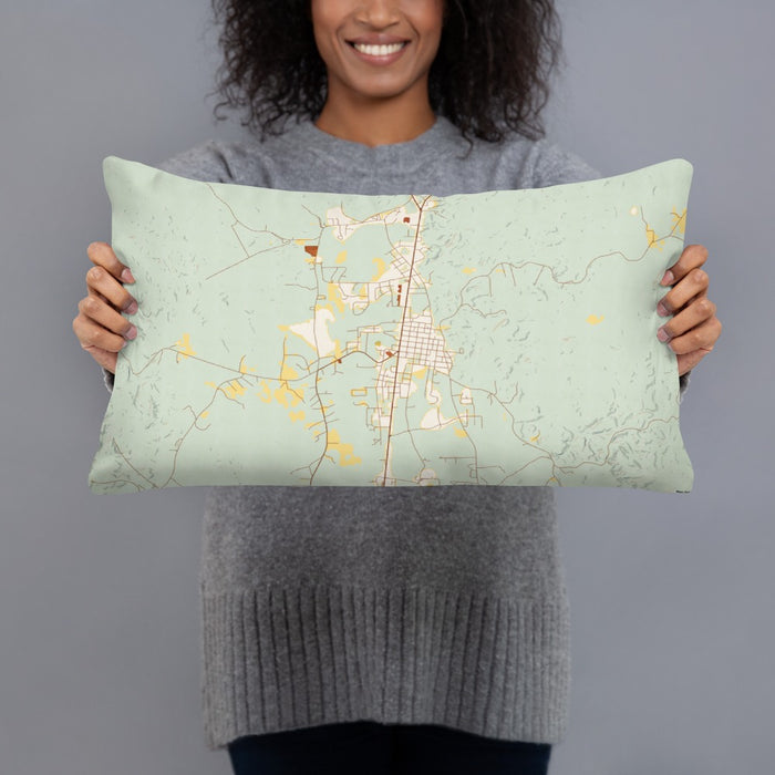 Person holding 20x12 Custom Thomasville Alabama Map Throw Pillow in Woodblock