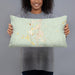 Person holding 20x12 Custom Thomasville Alabama Map Throw Pillow in Woodblock