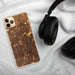 Custom Thornton Colorado Map Phone Case in Ember on Table with Black Headphones