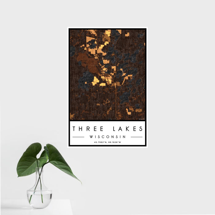 16x24 Three Lakes Wisconsin Map Print Portrait Orientation in Ember Style With Tropical Plant Leaves in Water